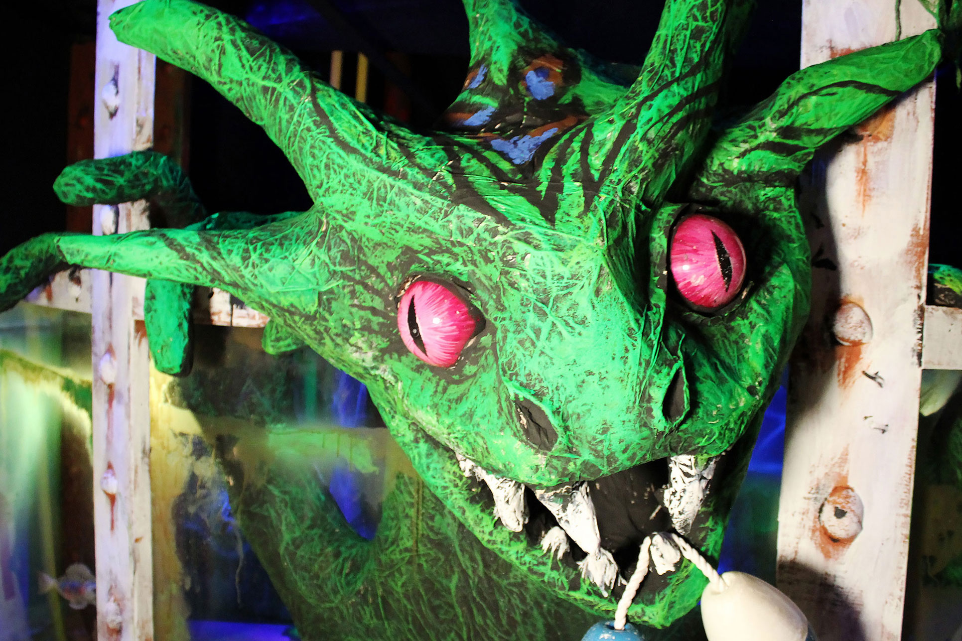 Green monster with red eyes.